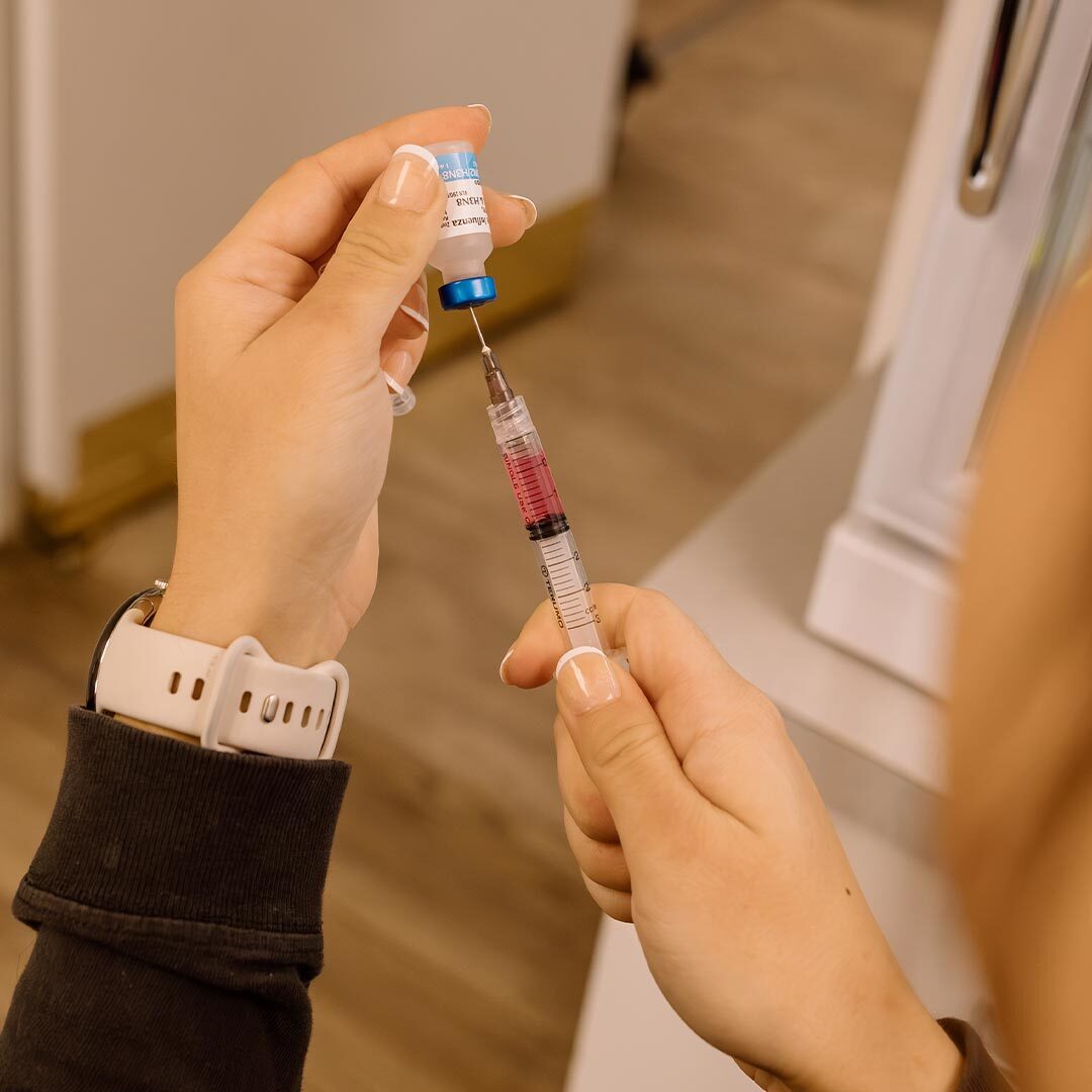 Female Filling Syringe With Medication For Vaccine